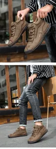 Close-up of brown outdoor casual boots showing fashion sport logo and hand-stitched detail