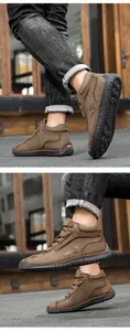 Detailed close-up of brown outdoor casual boots showing hand-stitched seams and rubber sole