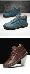 Close-up of hand-stitched leather boots in blue and brown with pebbled texture