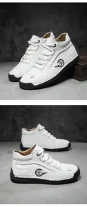 Detail of white leather high-top shoes with contrast stitching and fashion side logo