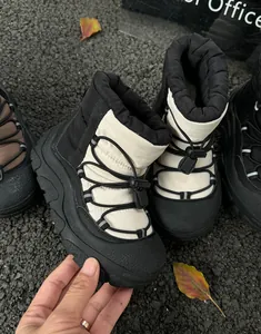 Detailed view of kids waterproof snow boots with quilted design and non-slip rubber soles