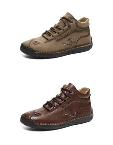 Detail of high-top leather boots showing handcrafted stitching and side sport fashion logo