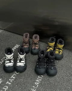 Detailed view of waterproof children's snow boots in four colors with anti-slip soles