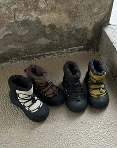 Detailed view of four colorful children's waterproof snow boots with toggle lacing system