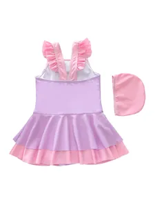 Detail of girls' purple and pink ruffled one-piece swimsuit and matching swim cap set