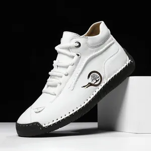 White high-top casual leather shoes for men featuring black soles and contrast stitching