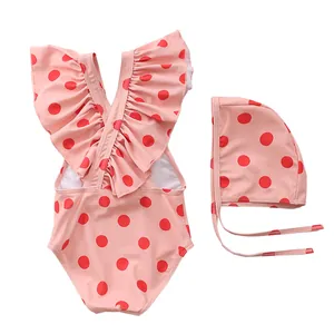 Toddler girl swimsuit set with red polka dots and ruffle details including swimming hat