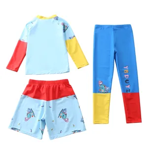 Dettaglio costume da bagno 3 pezzi per bambini con stampa dinosauro e tessuto rapido