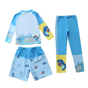 Completo da nuoto tre pezzi per bambini con maglia a maniche lunghe e stampa dinosauro