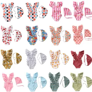 Kids ruffled one-piece swimsuit and swim cap set in various colorful stripe and fruit prints