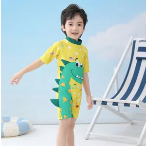 Boys yellow one-piece cartoon dinosaur swimwear with 3D fins and long sleeves for sun protection