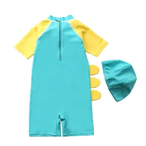 Detail of blue and yellow kids cartoon dinosaur swimwear set with cap and back zipper