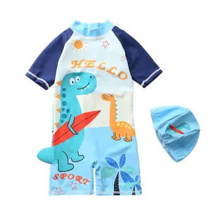 Close-up of boys dinosaur one-piece swimsuit with matching hat and 3D tail detail