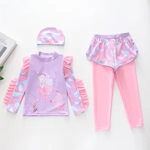 Three-piece long sleeve kids swimsuit with ruffles, lilac mermaid print, and swim cap