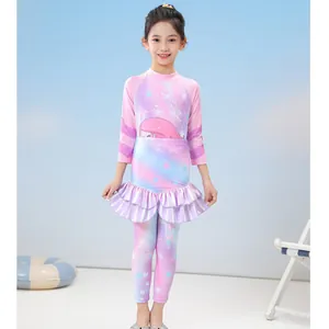 Three-piece girls' swimsuit set featuring mermaid print long sleeve top and pants