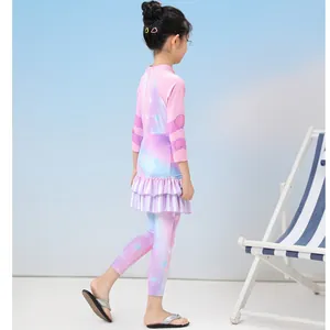 Detail of girls' two-piece swimsuit with ruffle hem and gradient starfish print