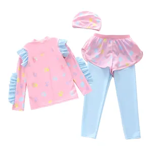 Detailed view of 3-piece kids long sleeve swimwear with ruffles and paw prints