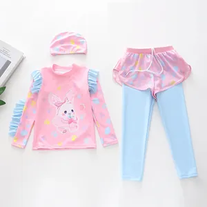 Detail view of kids' long-sleeve swimwear set with pink ruffle top and bunny print