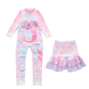 Close-up of pink long-sleeve kids swimsuit with mermaid scales and cartoon pattern