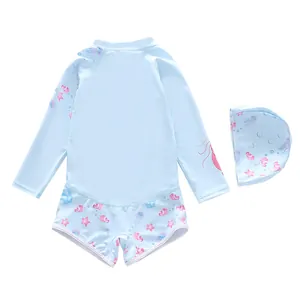 Close-up of sky blue kids long-sleeve swimsuit with sea creature prints and swimming cap