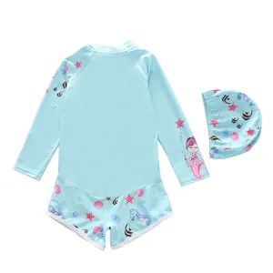 Detailed flat lay of kids long sleeve mermaid swimsuit set with matching swimming cap