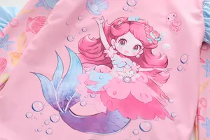 Close-up of pink girls' swimsuit featuring a cute mermaid princess print and sea elements