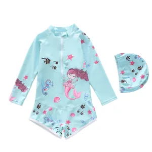 Kids long sleeve mermaid print swimsuit with matching swim cap on white background