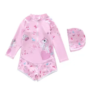 Pink girls long-sleeved unicorn swimsuit set with matching swimming cap for sun protection