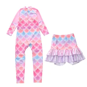 Detail of girls long sleeve mermaid swimsuit with colorful fish scale pattern and layered skirt