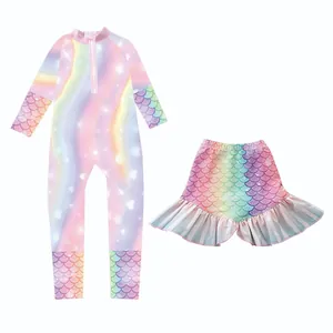 Detail of girls two-piece long sleeve swimsuit set with rainbow fish scale pattern