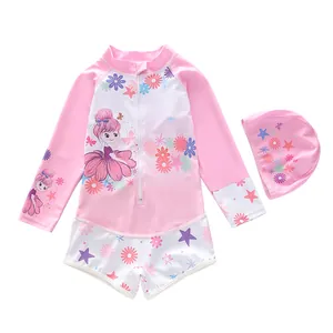 Detail of girls long-sleeve swimsuit set with pink cartoon prints and matching swim cap