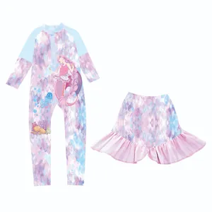 Detail of girls' two-piece long sleeve swimsuit with mermaid print and ruffled skirt
