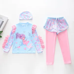 Detail of girls' 3-piece swimsuit with mermaid print, long sleeves and ruffle edges