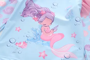 Close-up of light blue kids swimsuit featuring a mermaid and ocean theme print