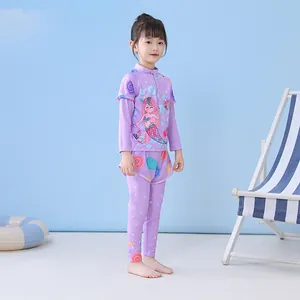 Three-piece purple kids' swimwear set featuring mermaid print with long sleeves and pants