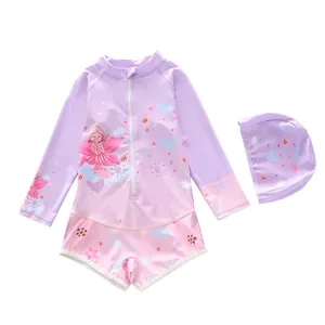 Detail of girls' long sleeve swimsuit with fairy print, front zipper and matching swim cap
