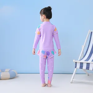 Rear view of girls' floral lavender long sleeve rash guard set with swimming gear
