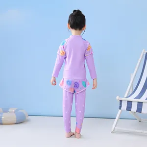Detail of girls' lilac long sleeve sun protection swimwear with seashell print back view