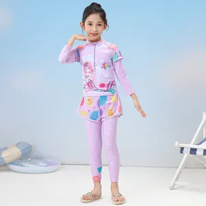 Detailed view of girls' purple long sleeve swimwear set with mermaid and shell patterns