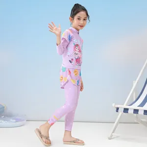 Detailed view of girls' 3-piece mermaid swimsuit with long sleeve top and floral swim pants
