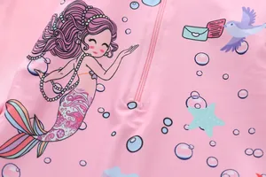 Close-up of kids mermaid swimwear showing the high-elastic fabric and pink zipper detail