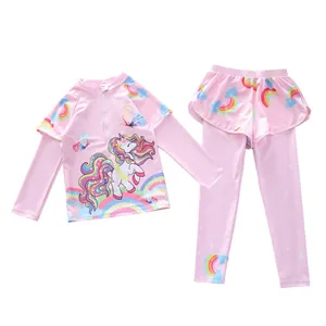 Detail of pink long sleeve girls' swimwear with unicorn print and mesh skirt leggings