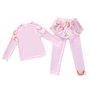 Close-up of pink long-sleeve kids' swimwear with vibrant rainbow and star prints