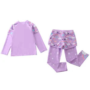 Detail of girls' purple long sleeve swimsuit with rainbow prints and matching long pants