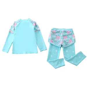 Detail of girls two-piece long sleeve swimsuit with rainbow and butterfly patterns