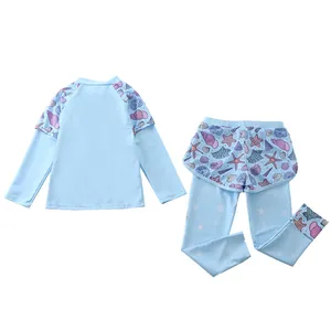 Detail view of kids long sleeve rash guard set with seashell and starfish prints