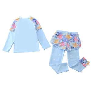 Detail of girls two-piece long sleeve swimsuit set with floral patterns and star prints