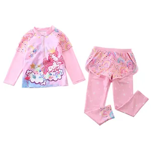 Detail of pink long sleeve kids swimsuit with unicorn and rainbow print on quick-dry fabric