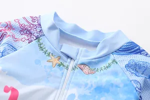 Close-up of girls' long sleeve swimwear with breathable mesh fabric and sea pattern print