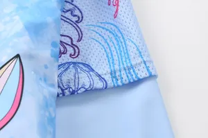 Detailed close-up of blue swimwear fabric featuring breathable mesh and flat seams